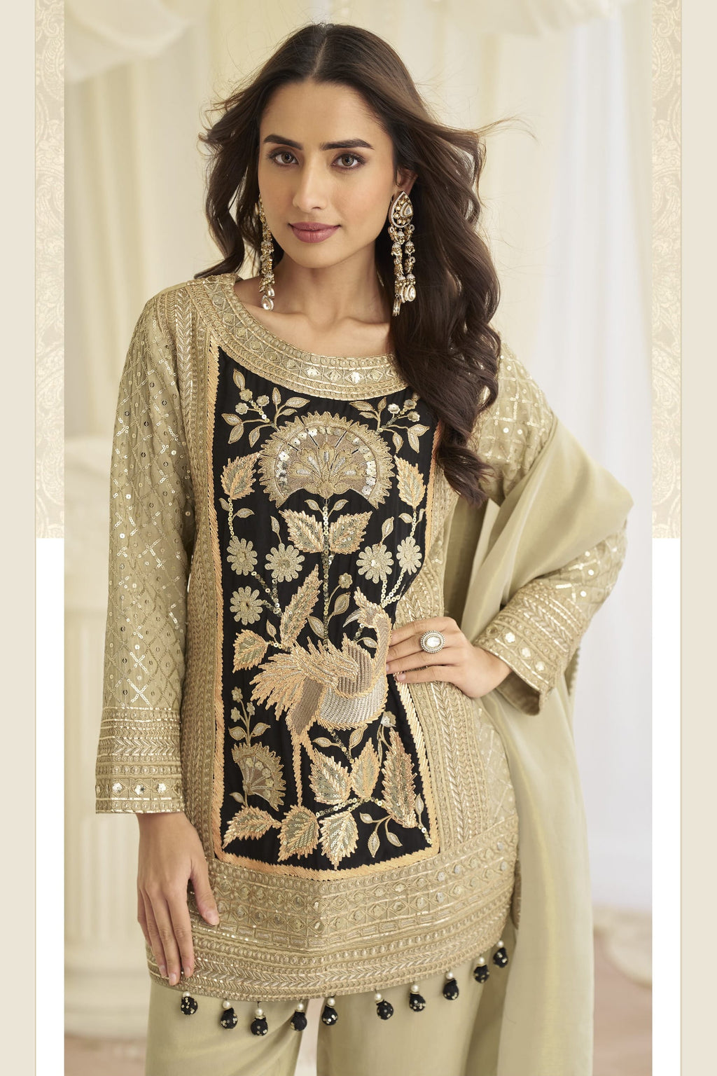 Close-up of the embroidered panel and gold thread florals on the beige palazzo kameez.