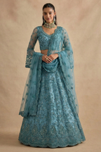 Full front view of the teal lehenga choli with long sheer sleeves and scalloped net dupatta — a refined long sleeve lehenga with thread and stone embroidery.