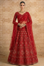 Full front view of the red lehenga choli with long embroidered sheer sleeves, V neckline and scalloped dupatta — timeless long sleeve reception lehenga with hand embroidery work.