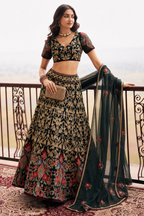 ladies in dark green lehenga with blouse & dupatta