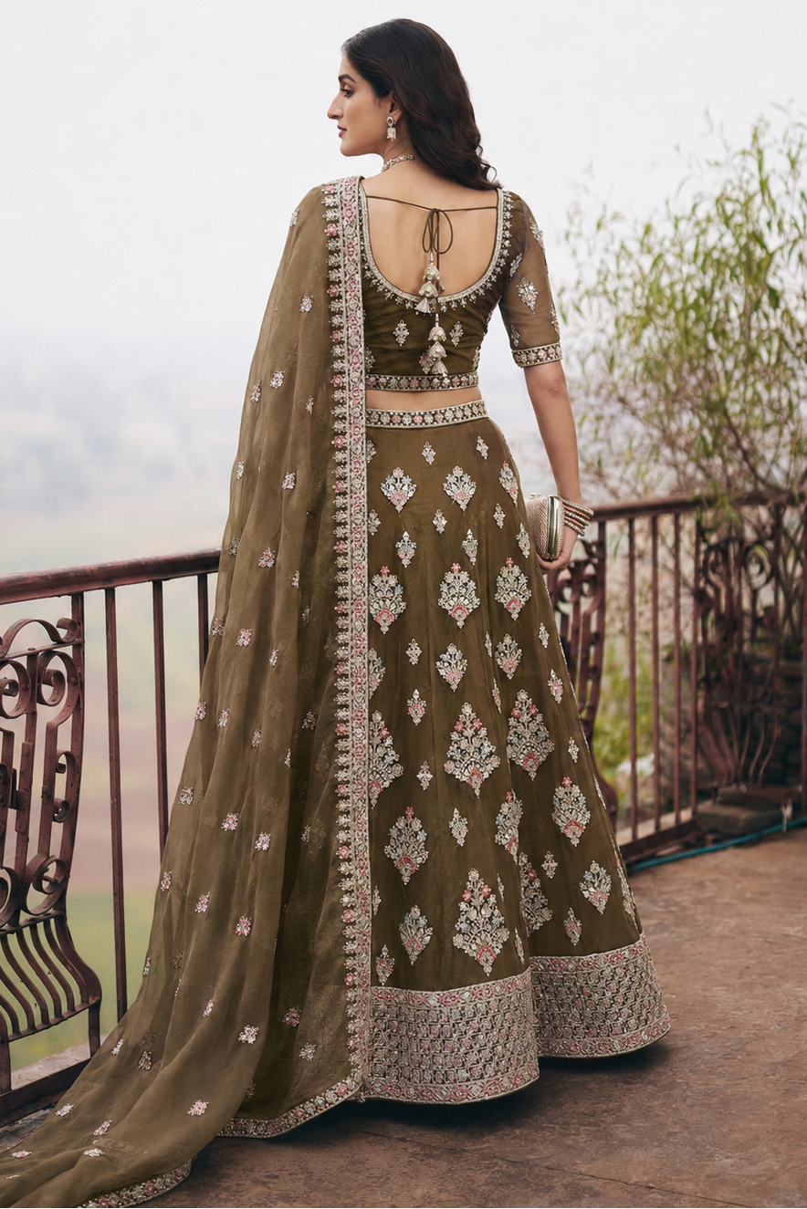 back view of women wearing brown lehenga in balcony