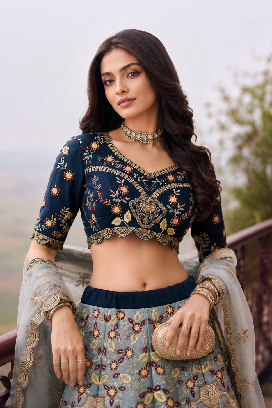 Upper view of a navy blue lehenga for wedding guest outfit showing the half sleeve silk choli with embroidery work detail.
