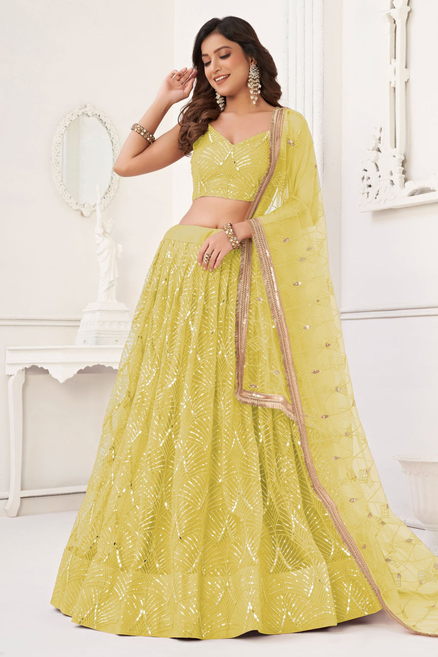 Yellow Net Lengha Dress for Engagement with Mirror Work