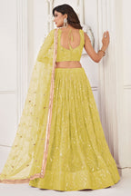 Yellow Net Lengha Dress for Engagement with Mirror Work