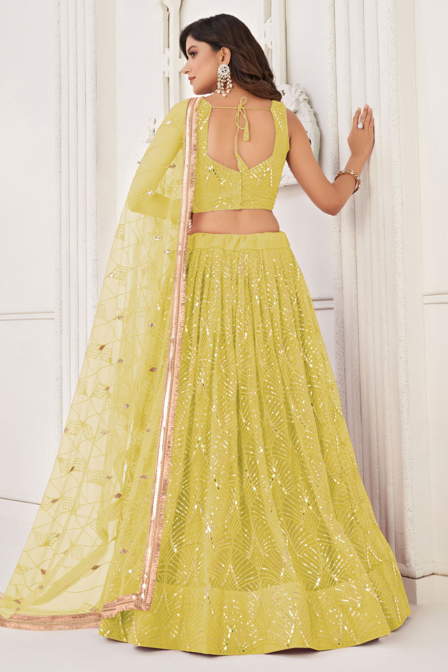 Yellow Net Lengha Dress for Engagement with Mirror Work