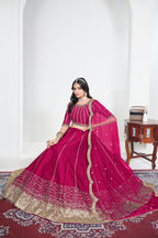 Alternate view of a pink mirror lehenga with mirror work on the lehenga skirt, seated pose, full outfit visible. All-over mirror work.