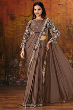 Women standing wearing Brown satin designer saree with 3/4 sleeve length blouse