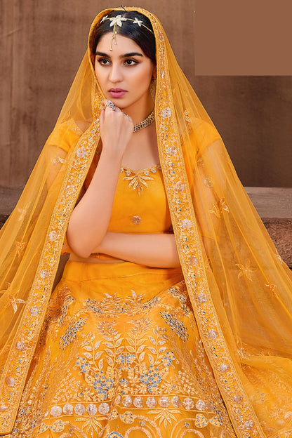 Golden Pakistani Net Lehenga Choli For Indian Festivals & Weddings - Thread Embroidery Work, Mirror Work, Zari Work