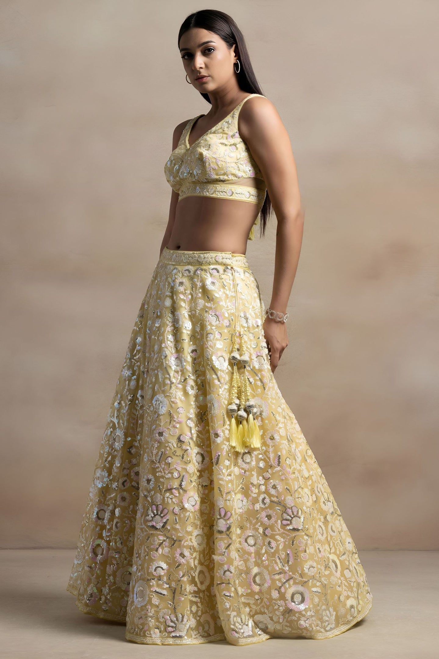 Yellow Net Pastel Lehenga Choli with Sequins and Thread Work