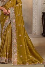 Mustard Olive satin saree with pearl, thread and sequin handwork, upper-body closeup of the embroidery and handwork detailing