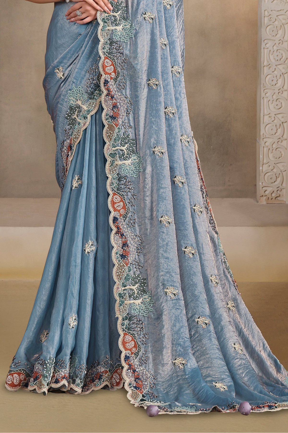 Powder Blue saree for engagement with pearl, thread and sequin handwork, waist-down view of the pleats and flowing saree drape