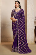 Purple saree for reception with thread embroidery and stone handwork, full front view of the model wearing the draped saree