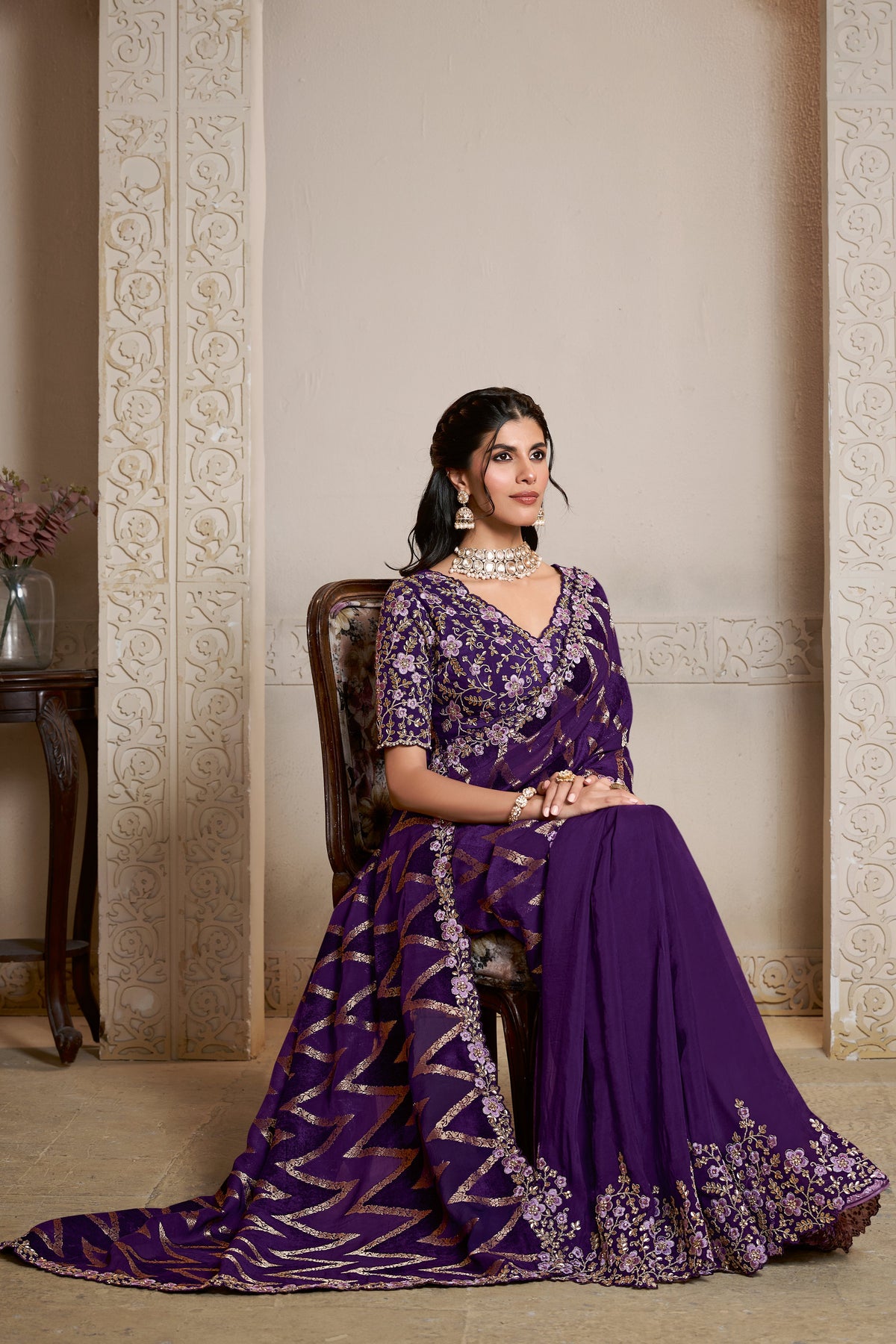 Purple saree with thread embroidery and stone handwork, upper-body closeup of the embroidery and handwork detailing