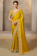 Mustard Yellow saree for wedding guest with sequin and stone handwork, full front view of the model wearing the draped saree