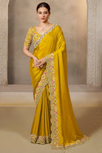 Mustard Yellow saree for wedding guest with sequin and stone handwork, full front view of the model wearing the draped saree