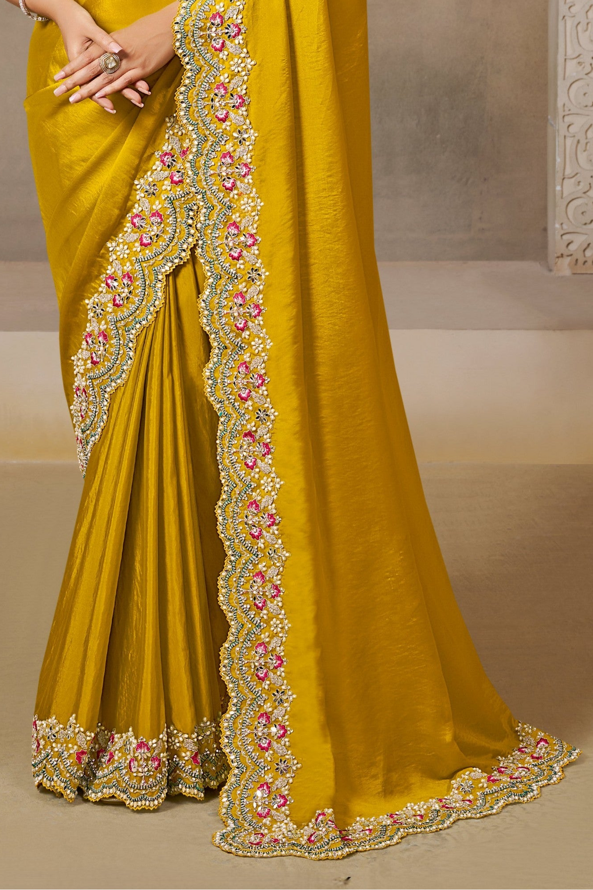 Mustard Yellow satin saree with sequin and stone handwork, upper-body closeup of the embroidery and handwork detailing