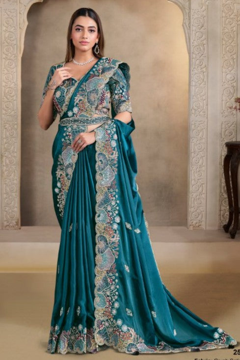 Teal saree for party with sequin, pearl and handwork, full front view of the model wearing the draped saree
