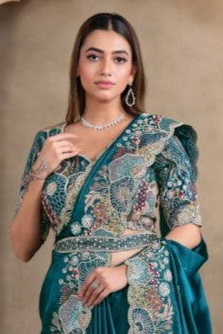 Teal sequin saree with sequin, pearl and handwork, front view showing the embellished blouse and detailed border