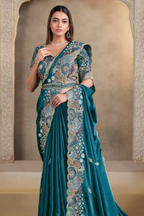 Teal sequin saree with sequin, pearl and handwork, waist-down view of the pleats and flowing saree drape
