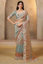 Dusty Blue saree for engagement with stone and thread handwork, full front view of the model wearing the draped saree