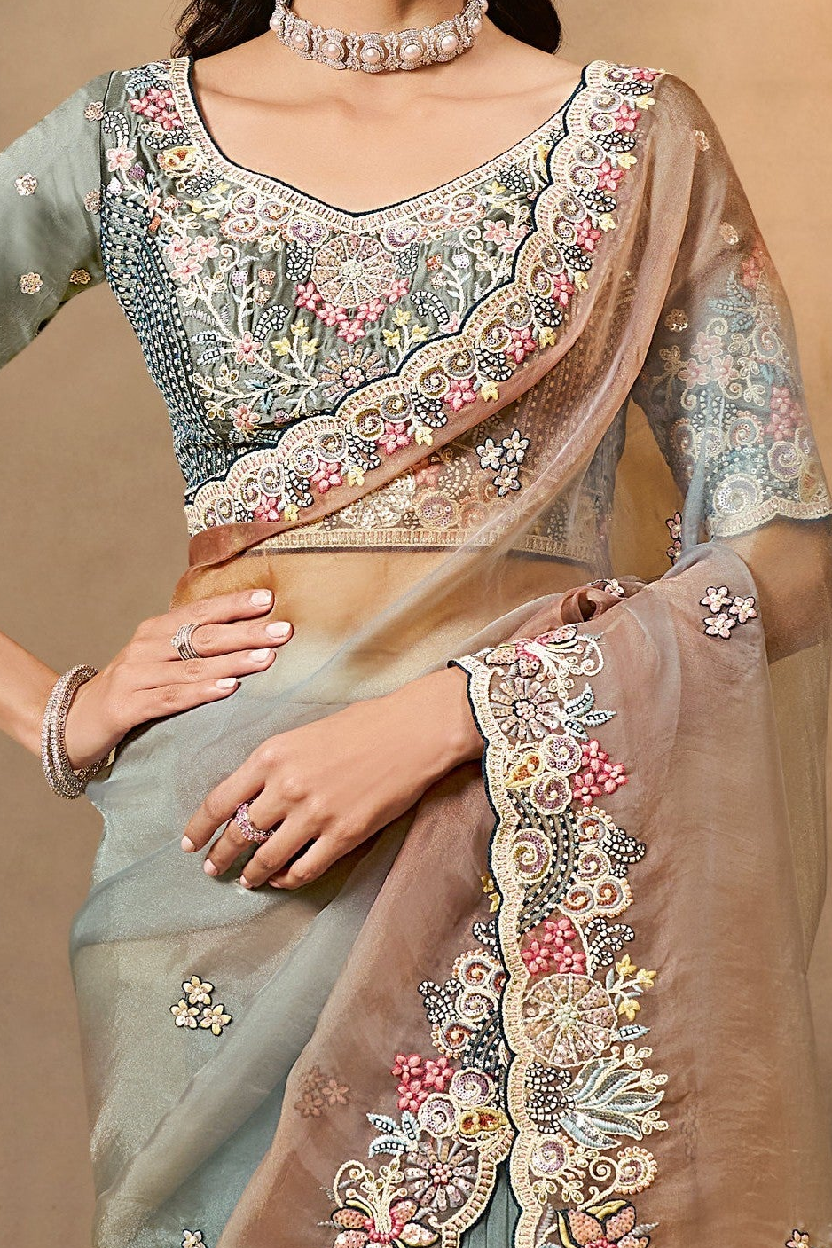 Dusty Blue organza saree with stone and thread handwork, waist-down view of the pleats and flowing saree drape