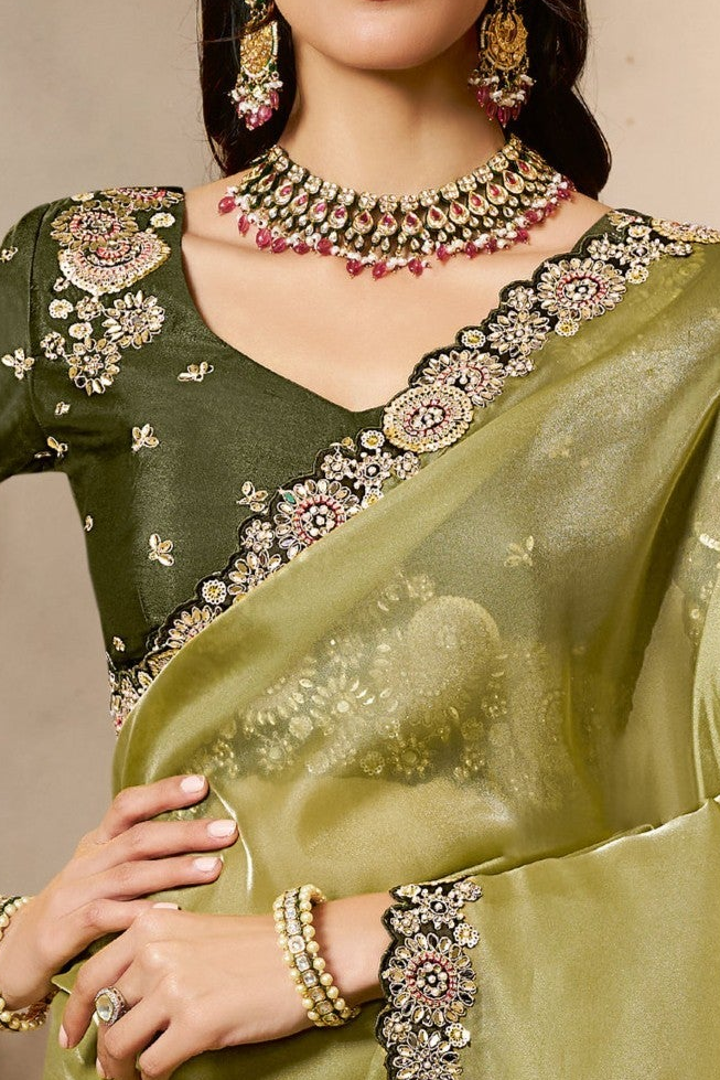 Olive Green sequin saree with sequin and stone handwork, waist-down view of the pleats and flowing saree drape