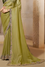 Olive Green organza saree with sequin and stone handwork, upper-body closeup of the embroidery and handwork detailing