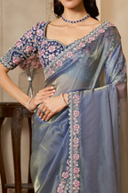 Slate Blue saree for party with pearl, stone and thread handwork, waist-down view of the pleats and flowing saree drape