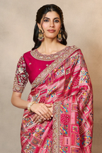 Reddish Pink wedding guest saree with thread embroidery and stone handwork, waist-down view of the pleats and flowing saree drape