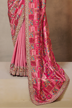Reddish Pink party wear saree for women with thread embroidery and stone handwork, upper-body closeup of the embroidery and handwork detailing