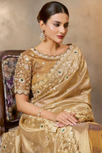 Champagne Golden embroidered saree with zardozi and stone handwork, front view showing the embellished blouse and detailed border