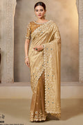 Champagne Golden saree for wedding with zardozi and stone handwork, full front view of the model wearing the draped saree
