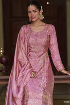 hald photo of Model wearing a light pink ladies embroidered plazo suit 