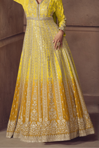 Lower front view of Yellow anarkali salwar suit side view with flowing flared skirt