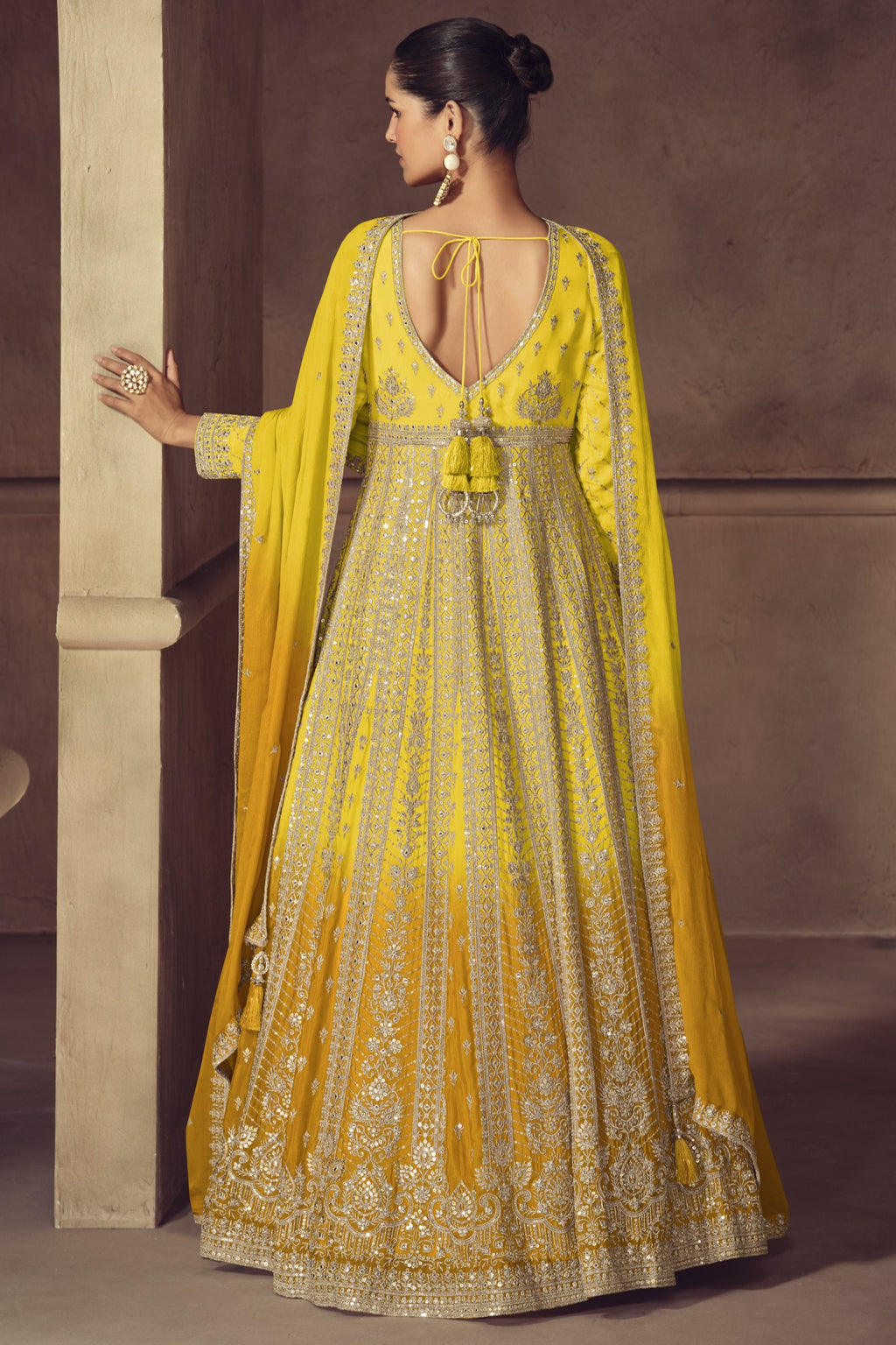 Yellow anarkali dress closeup showing bodice embroidery detail