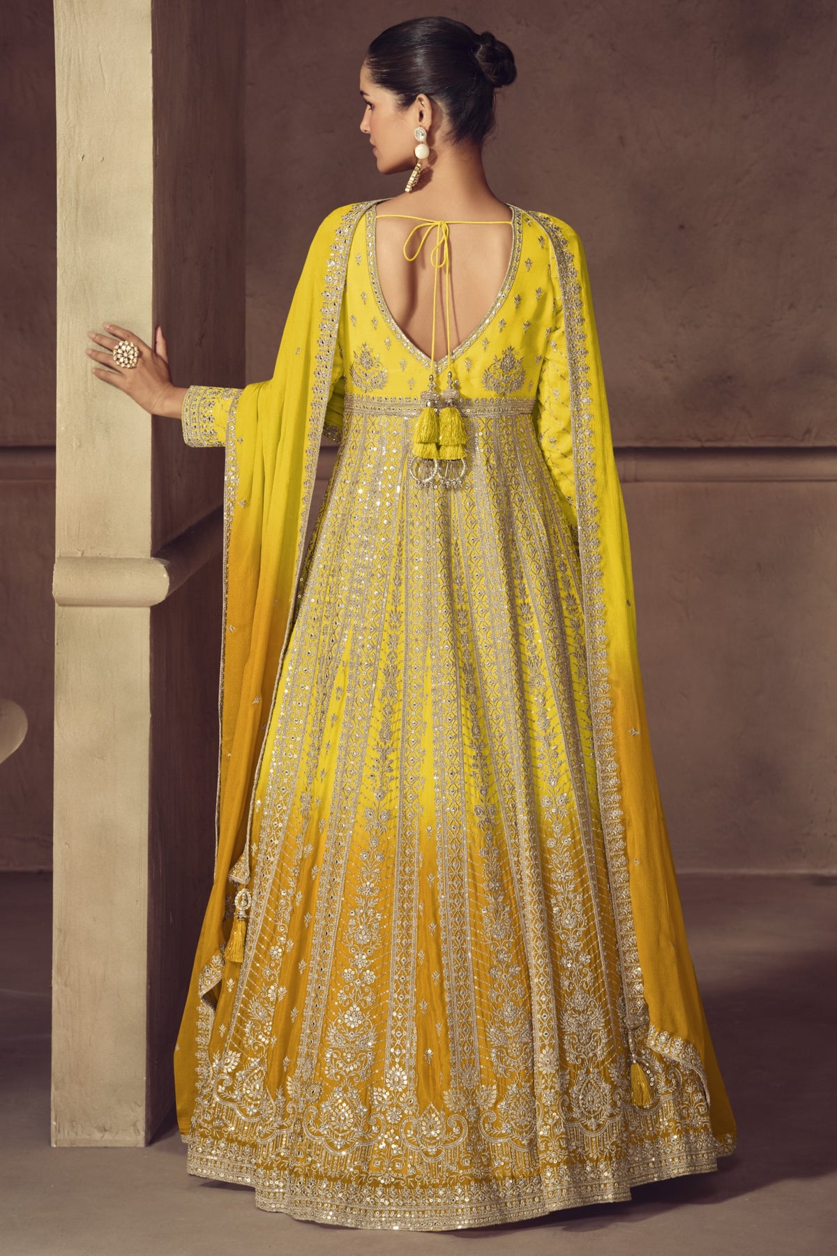 Yellow anarkali dress closeup showing bodice embroidery detail