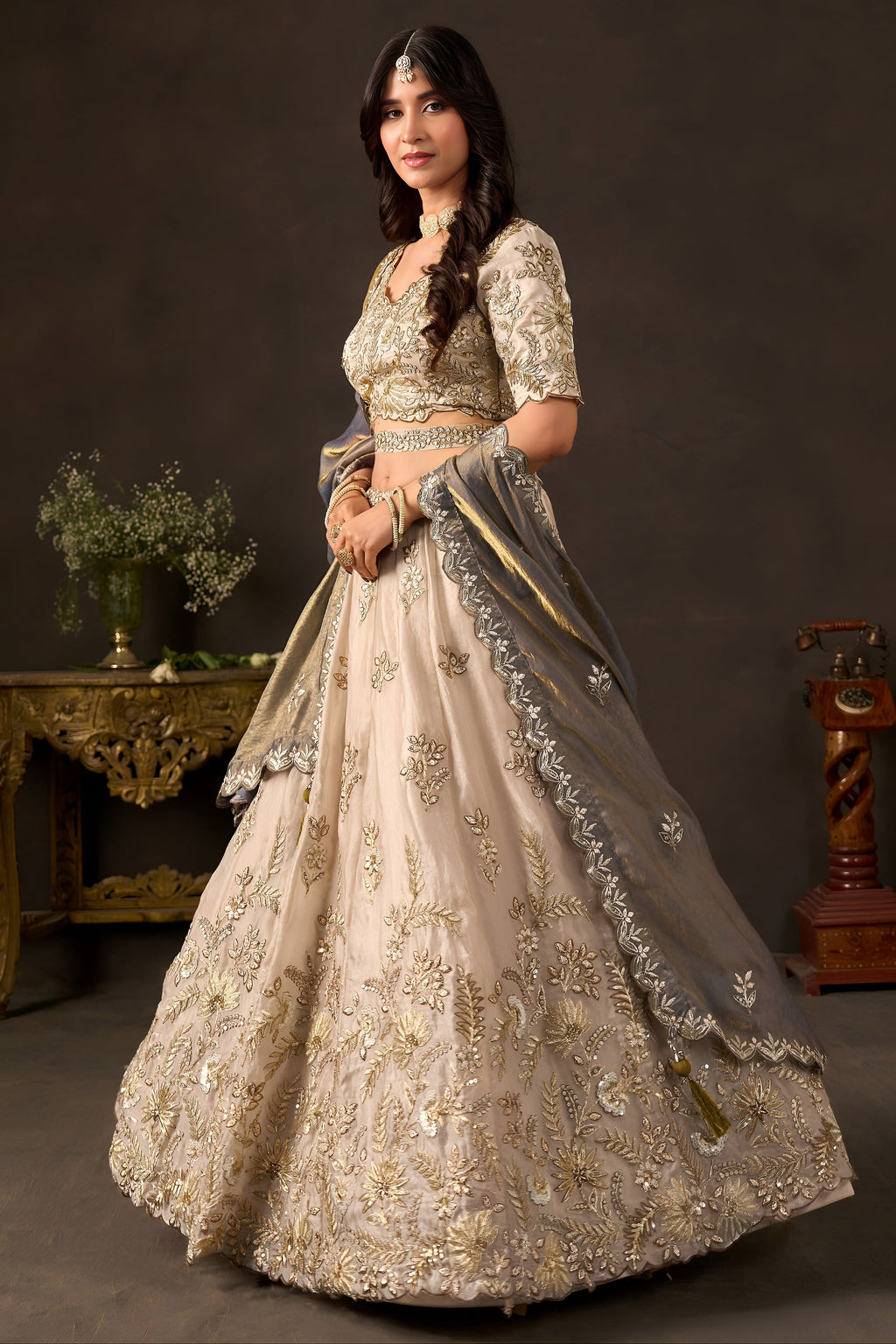 Detail of light beige fendy silk dupatta, zari and sequin embroidered border.