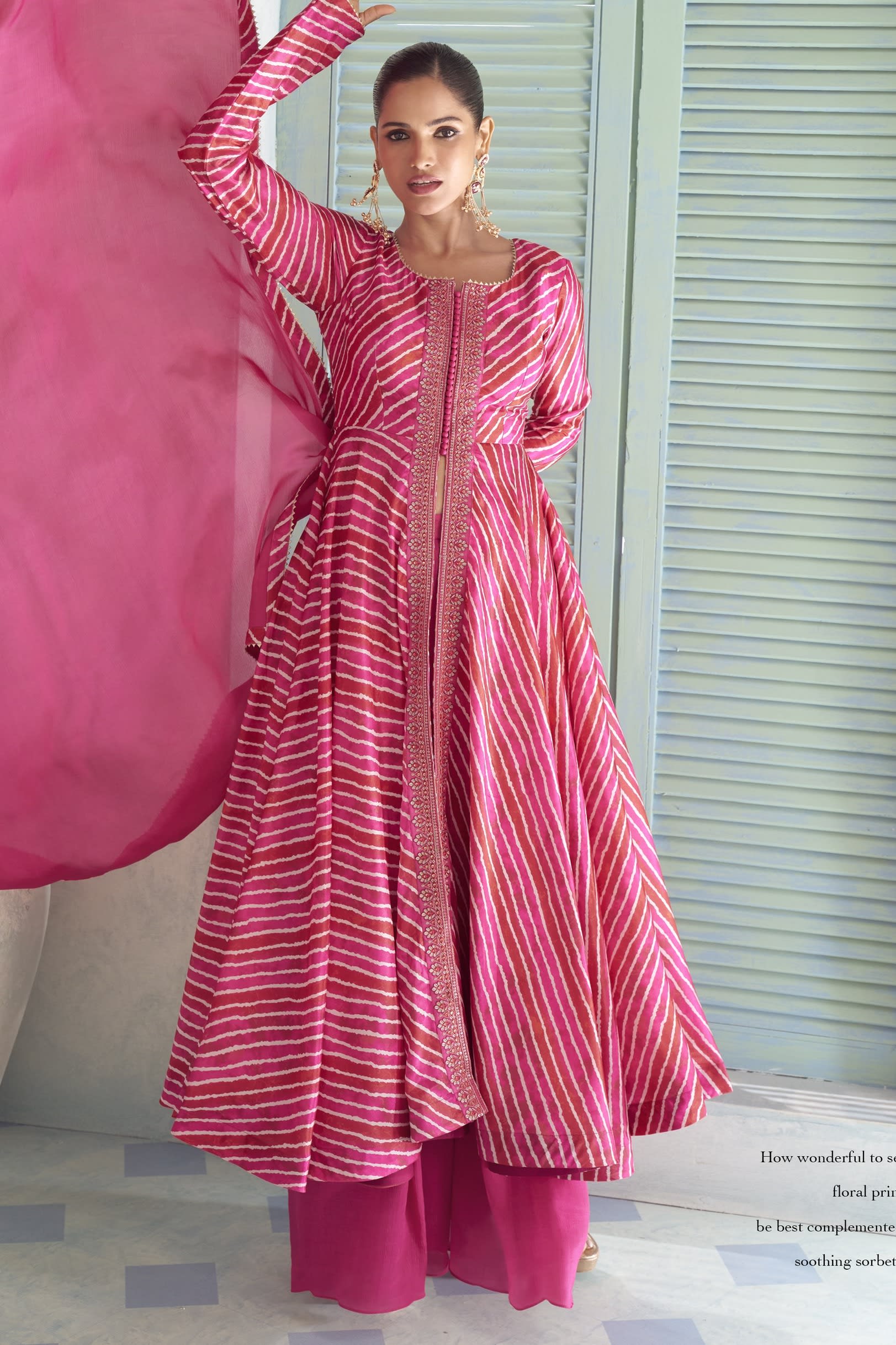 Fuchsia pink chinon silk kameez with plazo and a flowing dupatta, front view with print and sequin work.