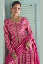 Close-up of the sequin and thread embroidery on the fuchsia pink kameez front placket and neckline.