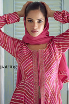 Detail of the fuchsia pink chinon silk kameez with the dupatta draped over the head, party wear look.