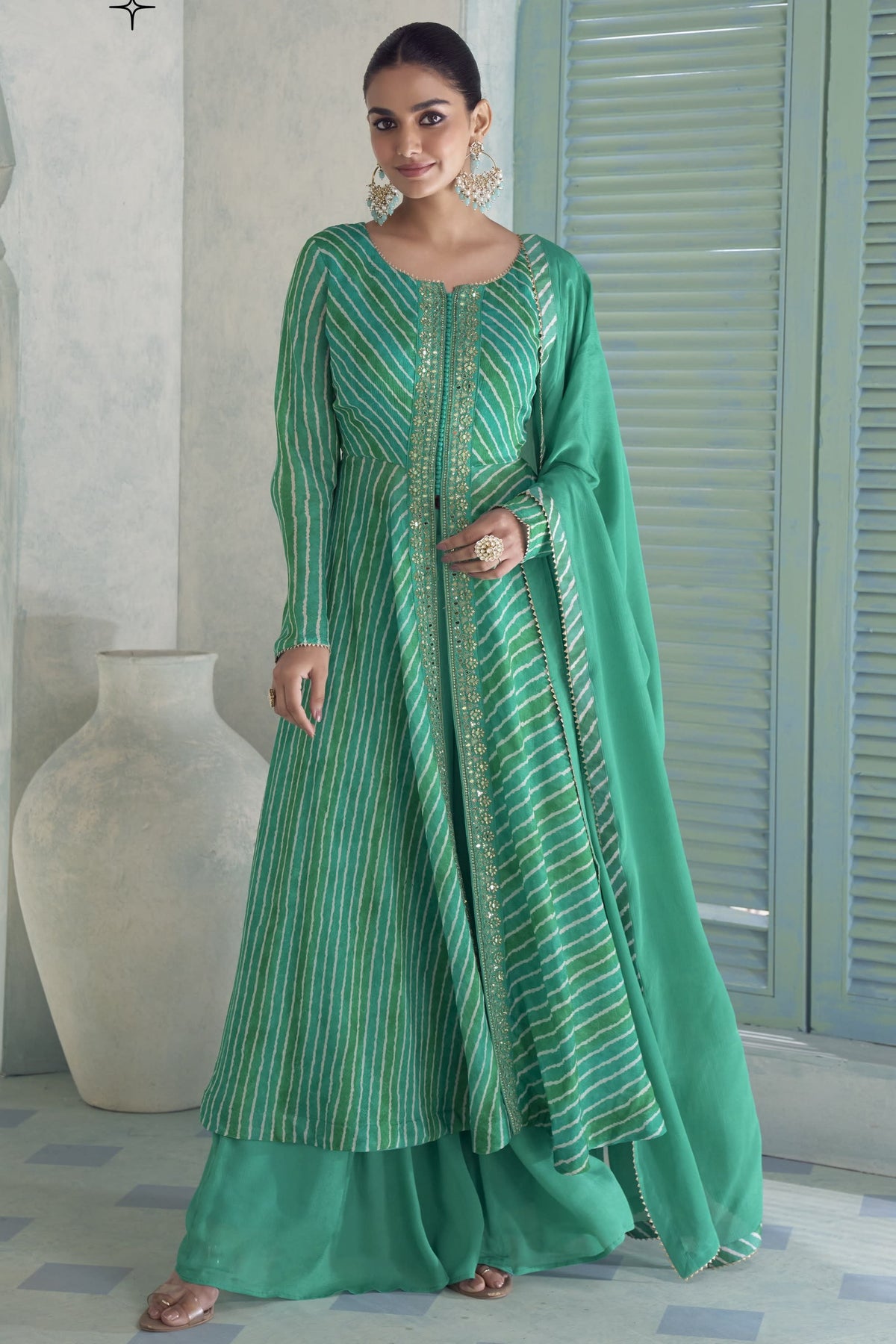 Emerald green chinon silk kameez with plazo and dupatta, front view with print and sequin work.