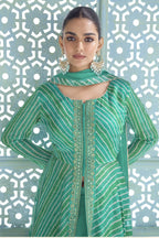 Close-up of the emerald green kameez neckline with sequin and thread embroidery detail.