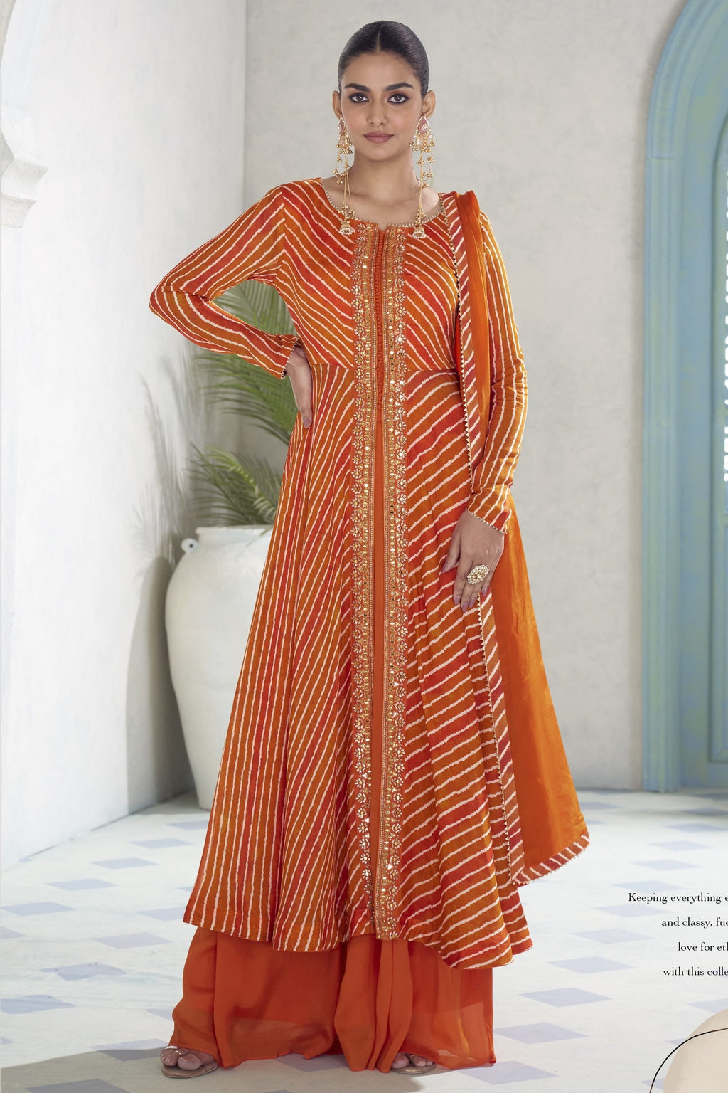Orange chinon silk kameez with plazo and dupatta, front view with print and sequin work.