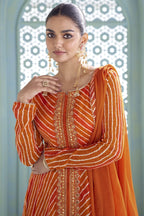 Close-up of the orange kameez front placket with sequin and thread embroidery detail.