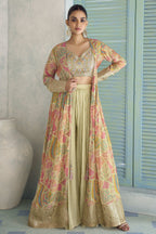 Beige palazzo suit with printed jacket and gold embroidered blouse, paired with flowing plazo pants.