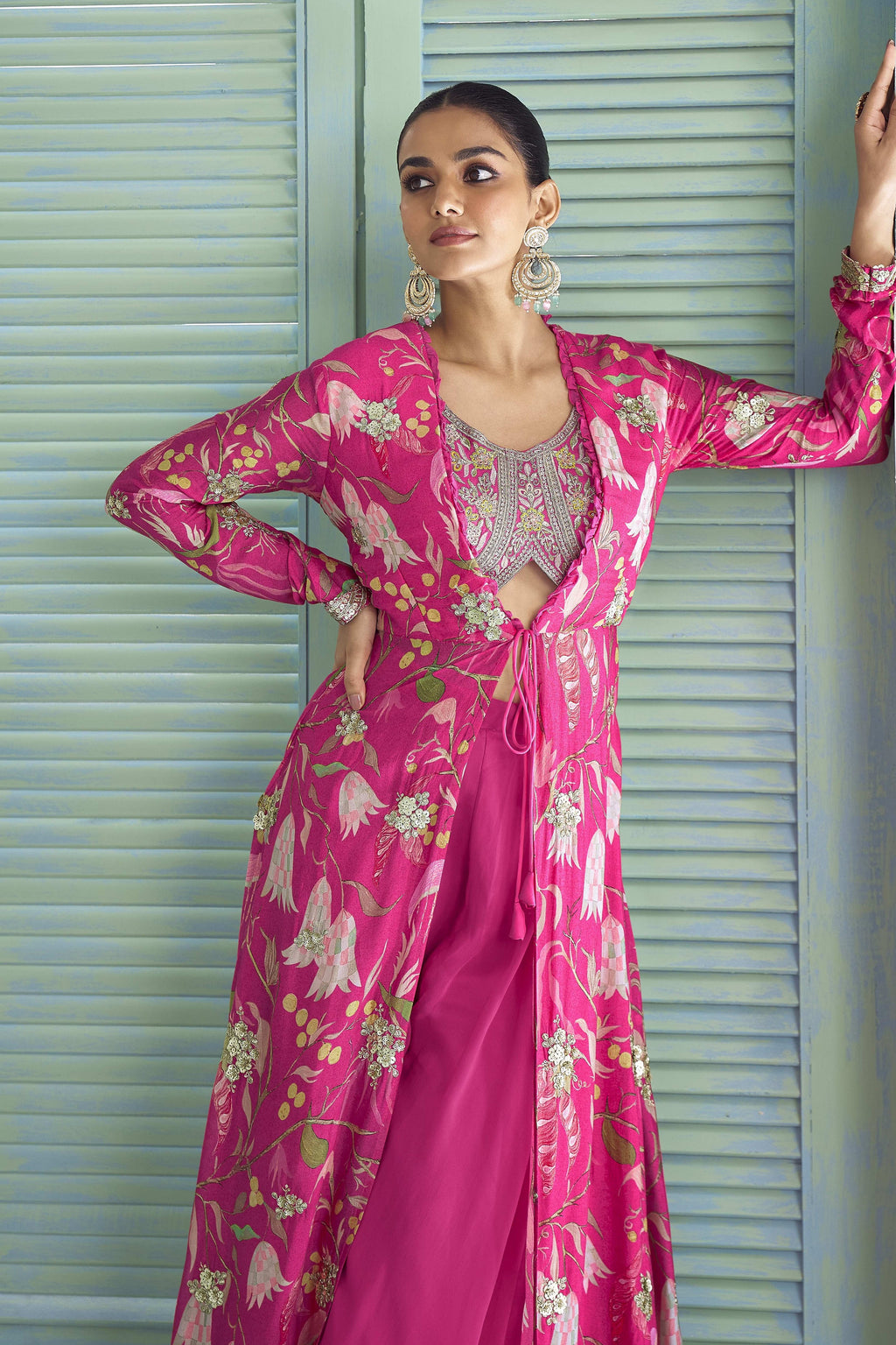 Detail shot of the hot pink palazzo suit's thread and sequins embroidery on chinon silk.