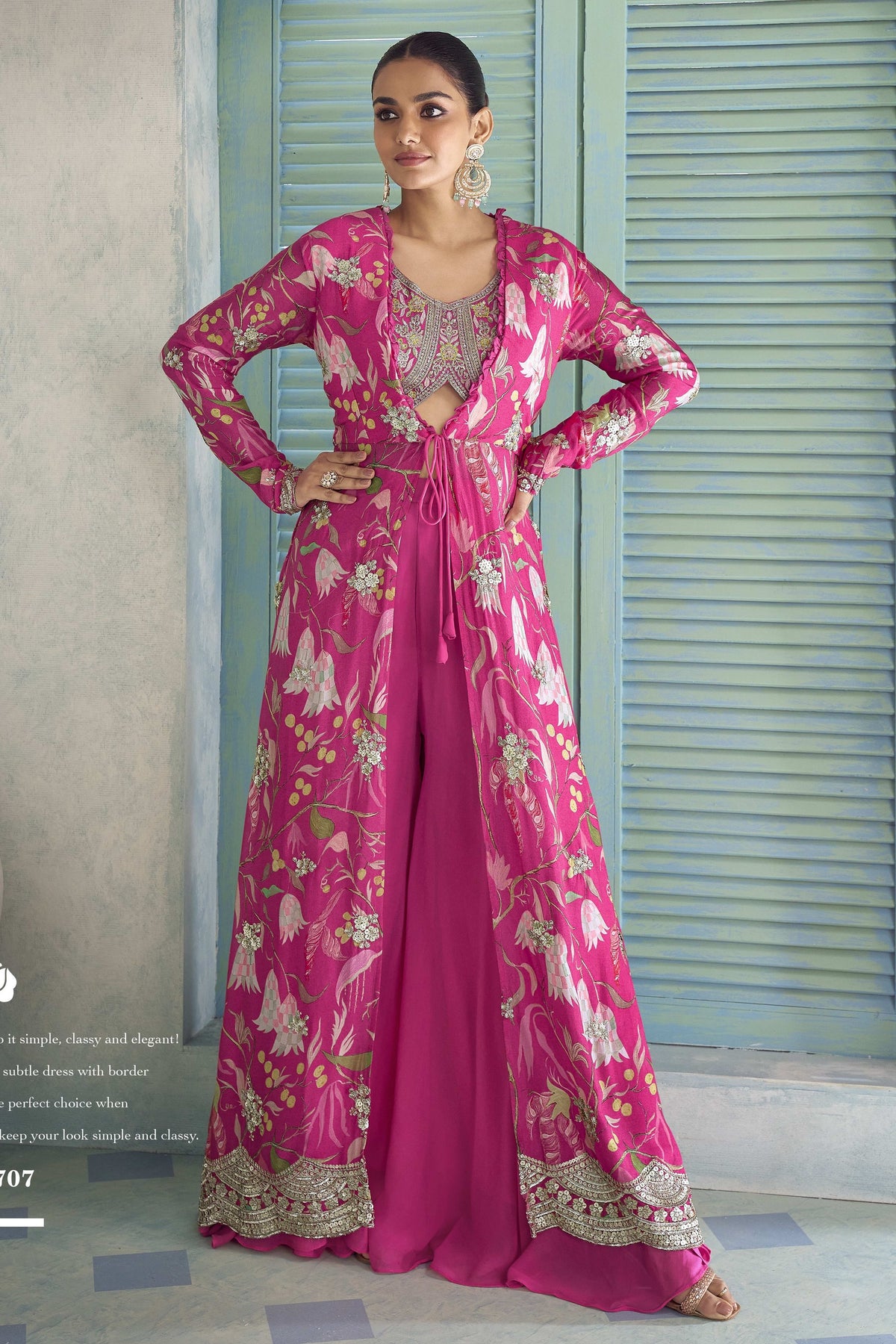 Hot pink palazzo suit with floral jacket and embroidered blouse, paired with flowing plazo pants.