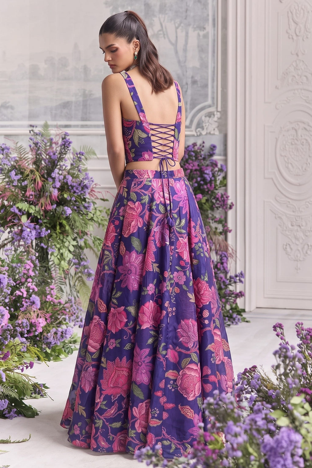 Back view of the blue lehenga choli, highlighting the deep neckline and criss-cross lace-up back tie.
