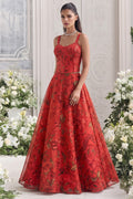 Red lehenga for marriage reception with sleeveless sweetheart blouse and floral organza skirt.