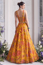 Back view of the mustard yellow lehenga choli, showing the deep neckline and lace-up back tie.